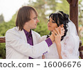Couple love bride and groom posing sitting on wood 16006676
