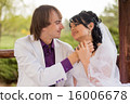 Couple love bride and groom posing sitting on wood 16006678