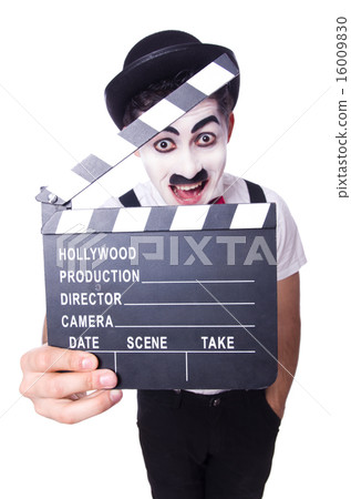 Man with movie clapper isolated on white 16009830