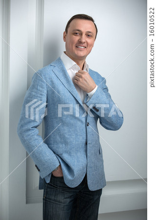 Handsome man in a blue jacket 16010522