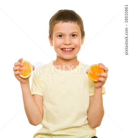 boy with sliced oranges 16010861