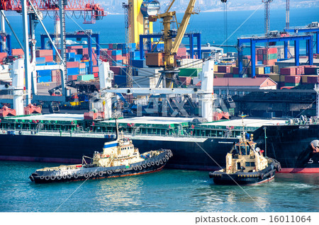 cargo ship and tug boat in port cargo ship and tug boat in port 16011064