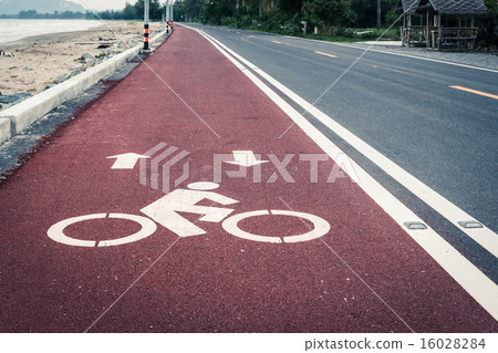 Bicycle lane or path on red asphalt road 16028284