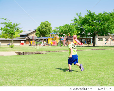 A boy running in the park A boy running in the park 16031896