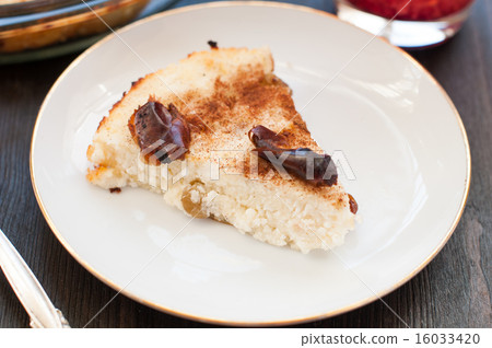 Piece of cottage cheese casserole with raisins Piece of cottage cheese casserole with raisins 16033420