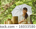 A girl in a sightseeing spot that has a parasol 16033580