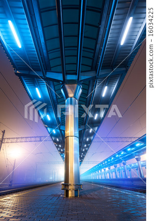 Railway station at night. Train platform in fog. 16034225