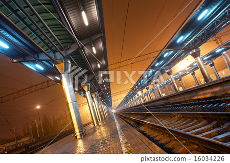Railway station at night. Train platform in fog Railway station at night. Train platform in fog 16034226