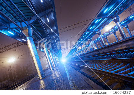 Railway station at night. Train platform in fog 16034227