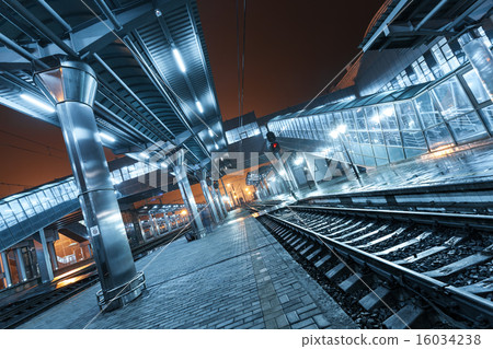 Railway station at night. Train platform in fog 16034238