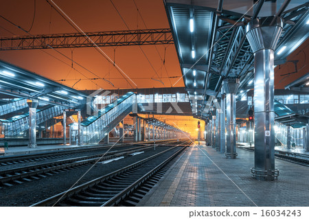 Railway station at night. Train platform in fog 16034243
