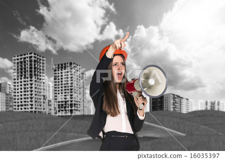 Woman in hardhat screaming in megaphone Woman in hardhat screaming in megaphone 16035397