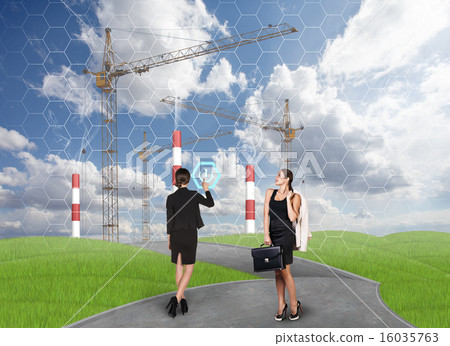 Business people in front af a factory 16035763