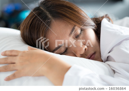 Asian woman sleeping on bed Asian woman sleeping on bed 16036864