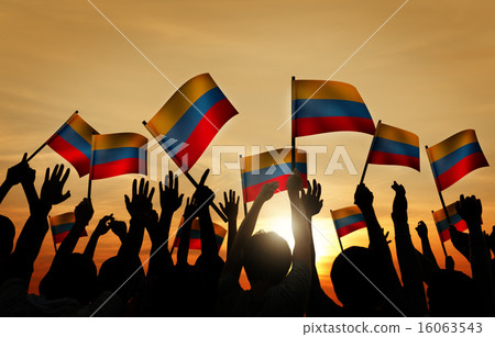 Group of People Waving Columbian Flags in Back Lit 16063543