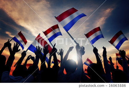 Silhouettes of People Holding Flag of Netherlands 16063886