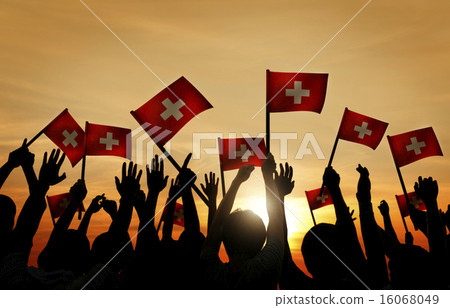 Group of People Waving Switzerland Flags in Back Lit Group of People Waving Switzerland Flags in Back Lit 16068049