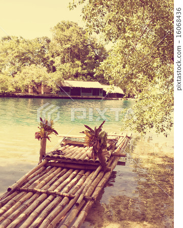 Raft on the bank of the  lagoon,with a retro effec 16068436