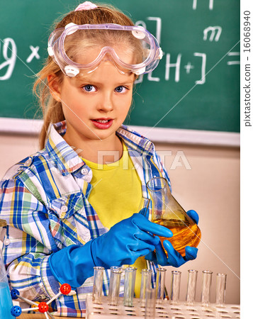 Child in chemistry class. Child in chemistry class. 16068940