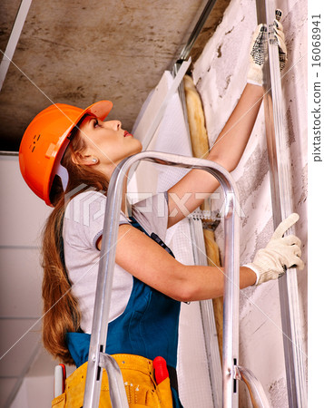 Woman in builder uniform. Woman in builder uniform. 16068941