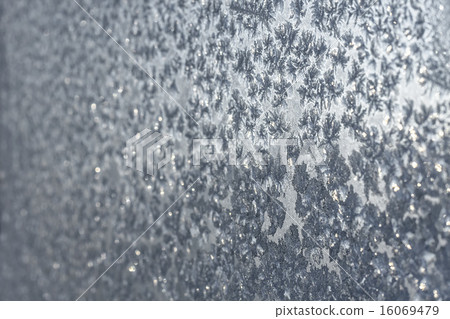 Snowflakes and ice on frozen window Snowflakes and ice on frozen window 16069479