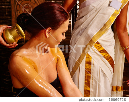 Woman having ayurveda spa treatment. Woman having ayurveda spa treatment. 16069728