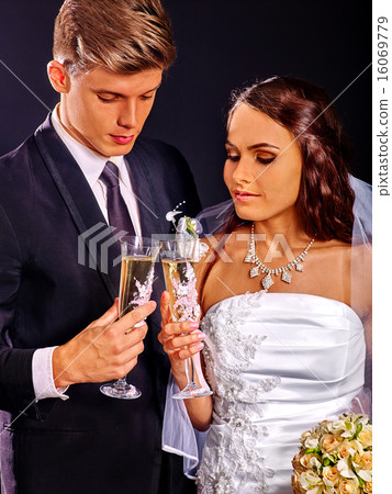 Wedding couple drinking champagne. Wedding couple drinking champagne. 16069779
