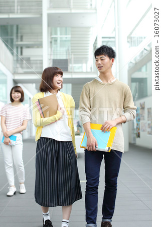 College students moving in the classroom while talking 16073027