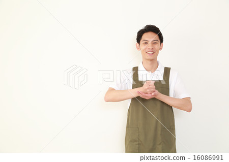 A man with a smile with an apron A man with a smile with an apron 16086991