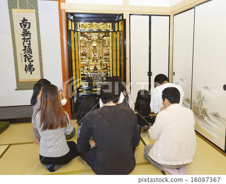 Family to touch hands on Buddhist altar 16087367