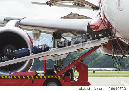 Loading luggage to commercial airplane 16090730