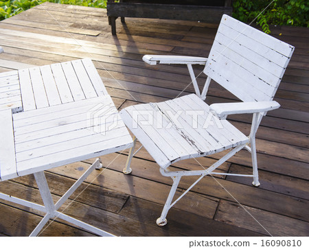Empty white garden chair and table 16090810