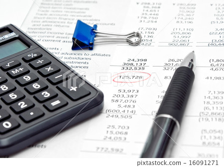 Financial report with calculator and pen Financial report with calculator and pen 16091271