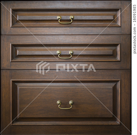 A section of wooden drawers 16091985