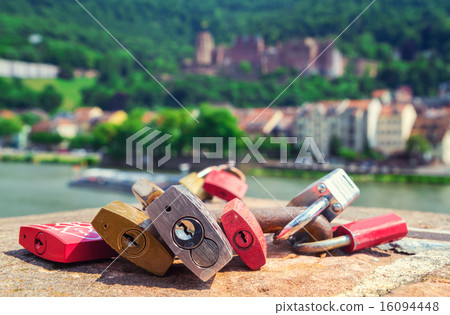 locks symbolizing love on a bridge in Heidelberg 16094448