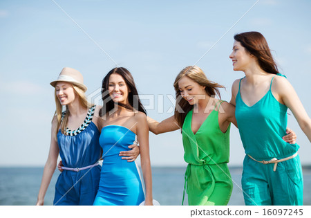 girls walking on the beach girls walking on the beach 16097245