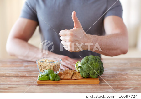 close up of male hands showing food rich in fiber close up of male hands showing food rich in fiber 16097724