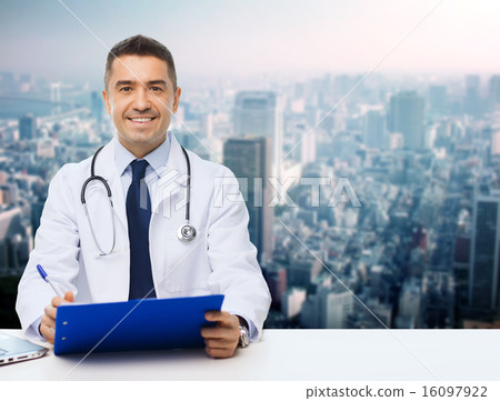 happy doctor with clipboard over city background 16097922