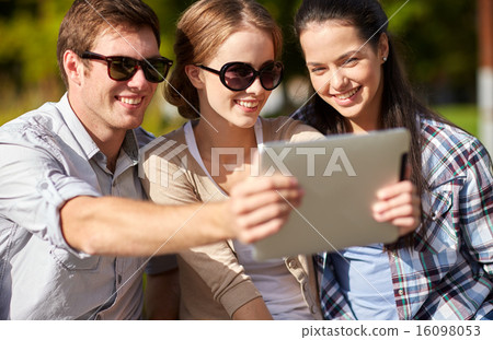 students or teenagers with tablet pc taking selfie 16098053