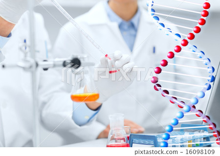 close up of scientists filling test tube in lab 16098109