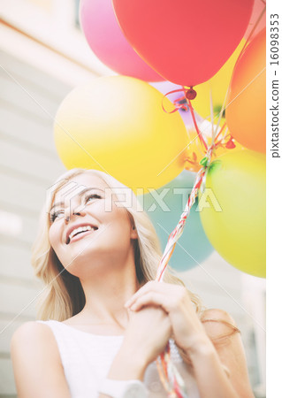 woman with colorful balloons 16098353