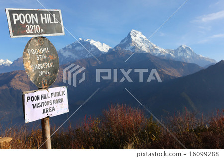 Poon hill altitude sign with Annapurna range in background, Nepa Poon hill altitude sign with Annapurna range in background, Nepa 16099288