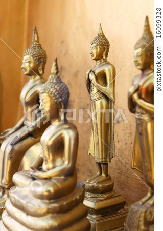 Standing gold buddha statues in Wangvivagegaram Temple, Karnjana 16099328