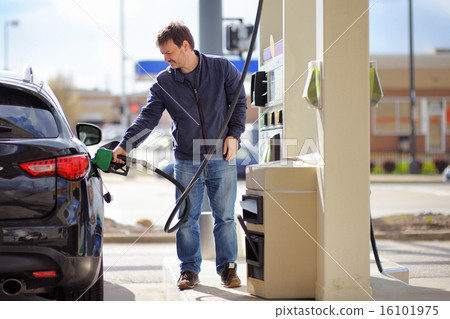 Man filling gasoline fuel in car 16101975