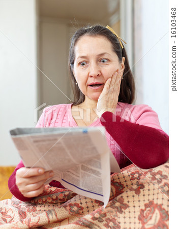 wonder mature woman with newspaper wonder mature woman with newspaper 16103468
