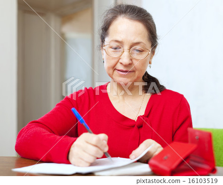 mature woman is calculated family budget mature woman is calculated family budget 16103519