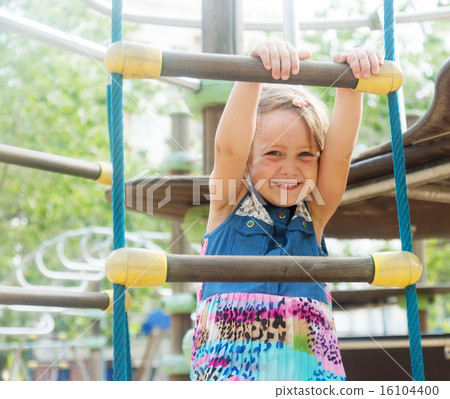 Girl at action-oriented playground Girl at action-oriented playground 16104400