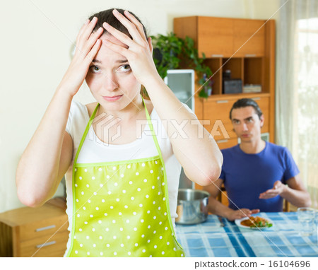 girl serving food her man at table 16104696