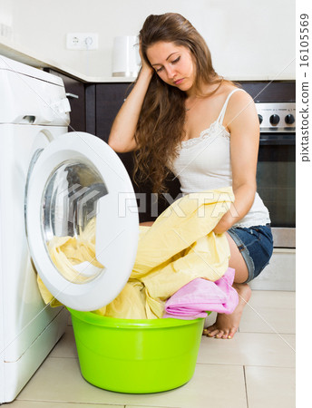 Girl near washing machine Girl near washing machine 16105569