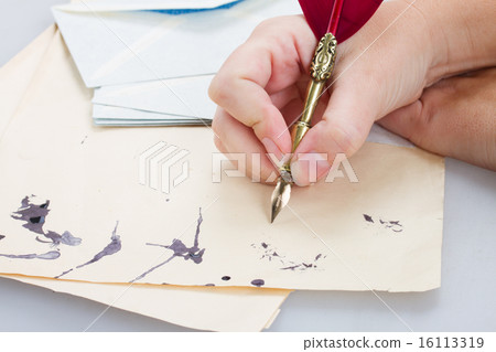 hand holding feather pen hand holding feather pen 16113319
